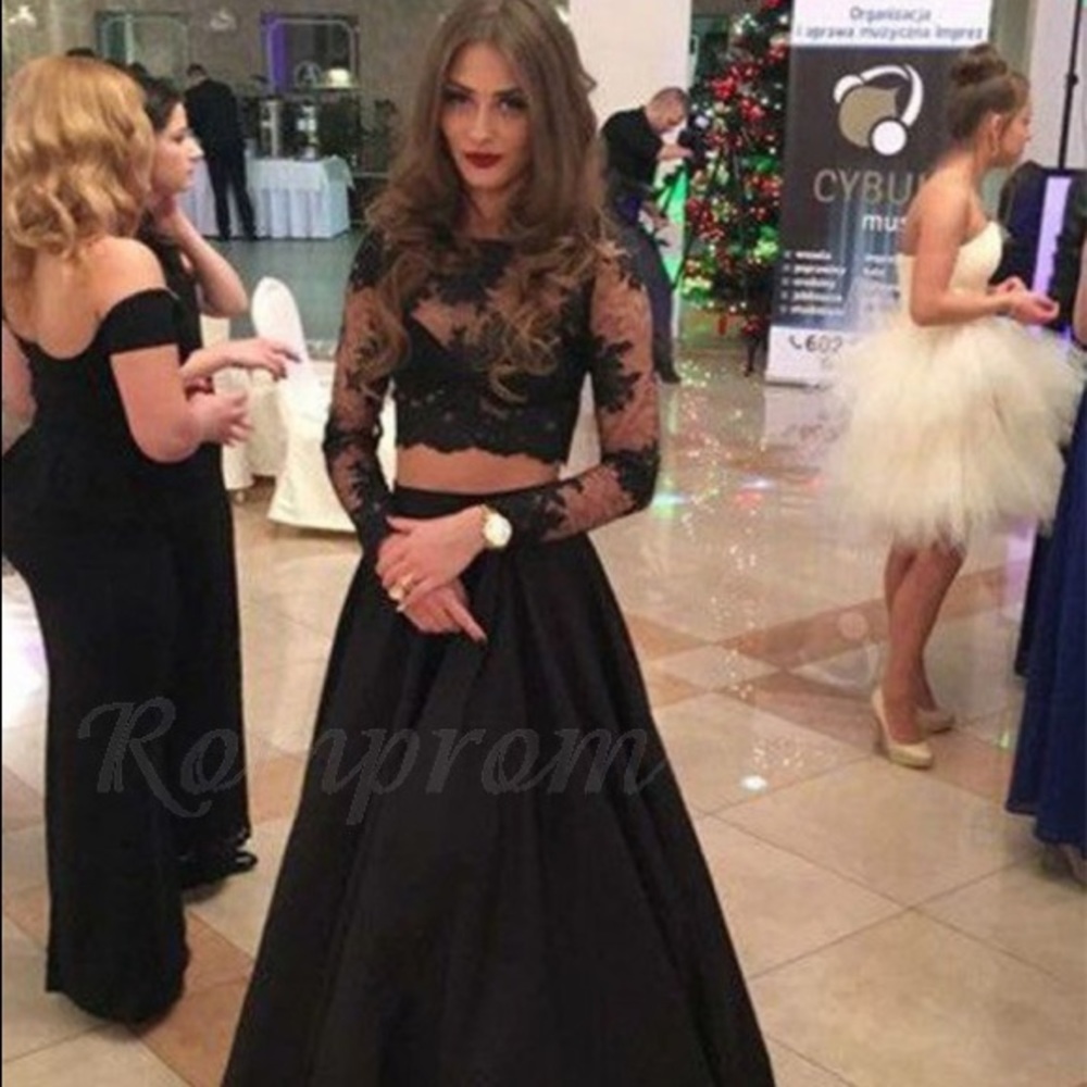 Long black long sleeve two piece prom dress.